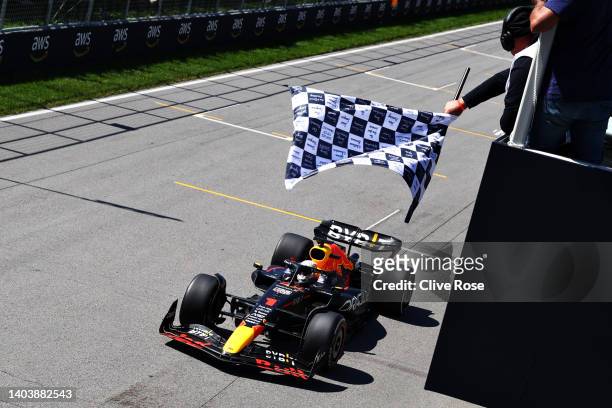 Race winner Max Verstappen of the Netherlands driving the Oracle Red Bull Racing RB18 takes the chequered flag during the F1 Grand Prix of Canada at...