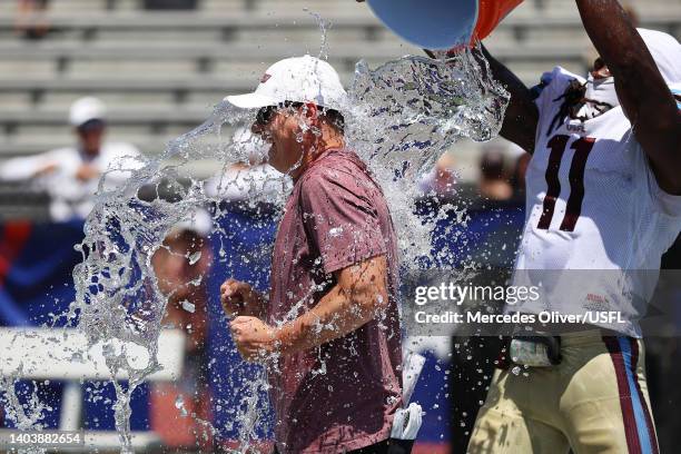 Michigan Panthers coach is doused in water by La'Michael Pettway of the Michigan Panthers after the Michigan Panthers defeated the Pittsburgh Maulers...