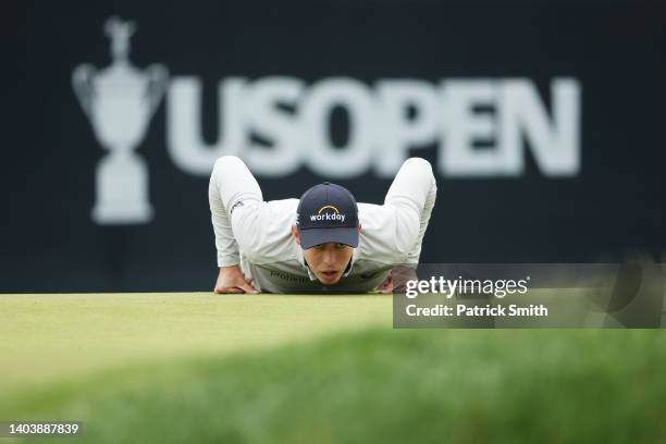 Matthew Fitzpatrick of England lines up a putt on the sixth green during the final round of the 122nd U.S. Open Championship at The Country Club on...