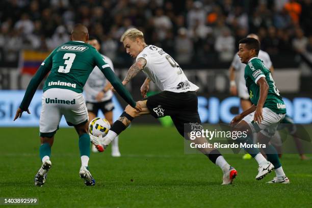 Roger Guedes of Corinthians competes for the ball with Da Silva of Goias during the match between Corinthians and Goias as part of Brasileirao Series...
