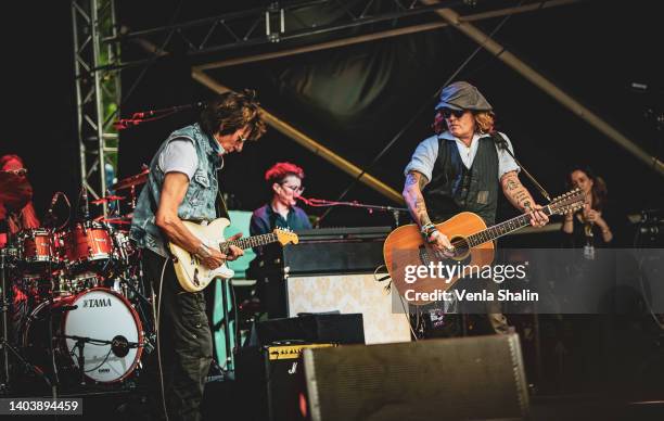 Johnny Depp performs on stage with Jeff Beck during the Helsinki Blues Festival at Kaisaniemen Puisto on June 19, 2022 in Helsinki, Finland.