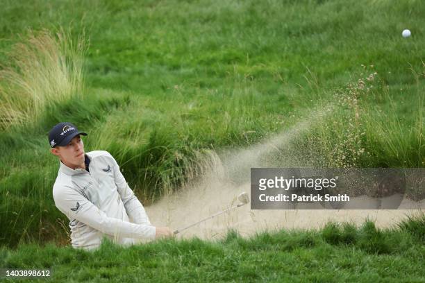 Matt Fitzpatrick of England plays a shot from a bunker on the tenth hole during the final round of the 122nd U.S. Open Championship at The Country...