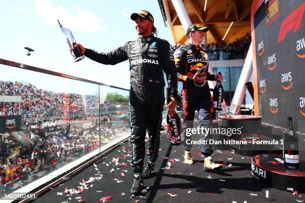 Third placed Lewis Hamilton of Great Britain and Mercedes celebrates on the podium with race winner Max Verstappen of the Netherlands and Oracle Red...