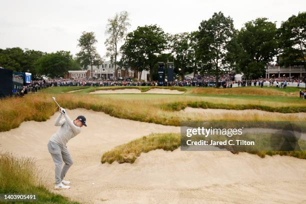 Matt Fitzpatrick of England plays a shot from a fairway bunker on the 18th hole during the final round of the 122nd U.S. Open Championship at The...