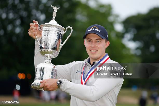 Matt Fitzpatrick of England celebrates with the U.S. Open Championship trophy after winning during the final round of the 122nd U.S. Open...