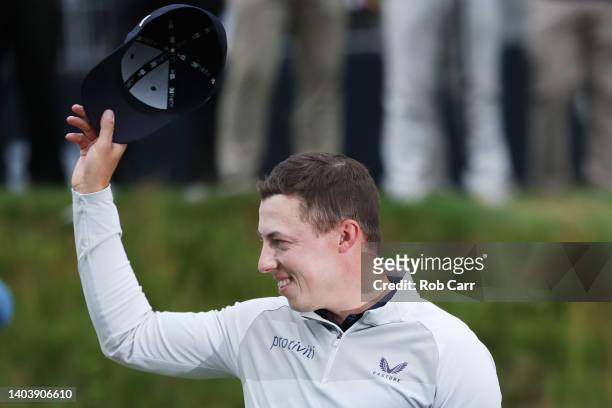 Matt Fitzpatrick of England waves in celebration of his victory after the final round of the 122nd U.S. Open Championship at The Country Club on June...