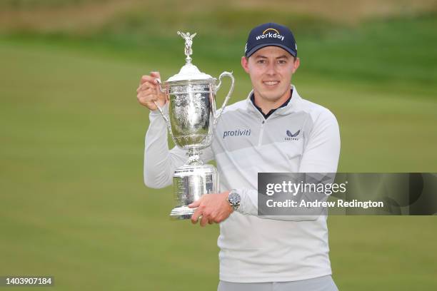 Matt Fitzpatrick of England celebrates with the U.S. Open Championship trophy after winning during the final round of the 122nd U.S. Open...