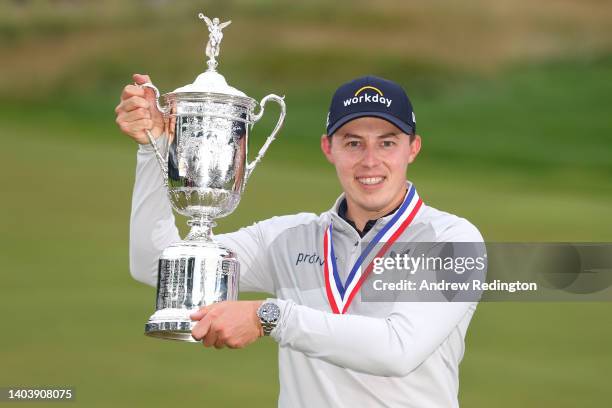 Matt Fitzpatrick of England celebrates with the U.S. Open Championship trophy after winning during the final round of the 122nd U.S. Open...