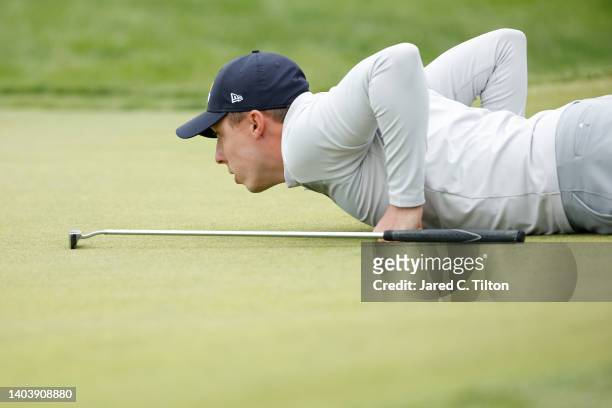 Matt Fitzpatrick of England lines up a putt on the 15th green during the final round of the 122nd U.S. Open Championship at The Country Club on June...
