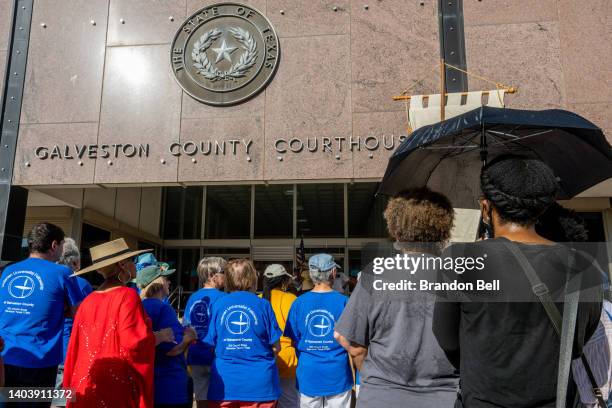 People participate in a rally at the Galveston County Courthouse on June 19, 2022 in Galveston, Texas. Galveston island is the birthplace of...