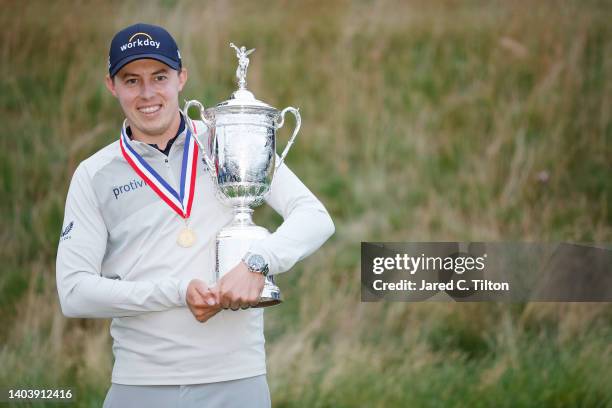 Matt Fitzpatrick of England celebrates with the U.S. Open Championship trophy after winning during the final round of the 122nd U.S. Open...