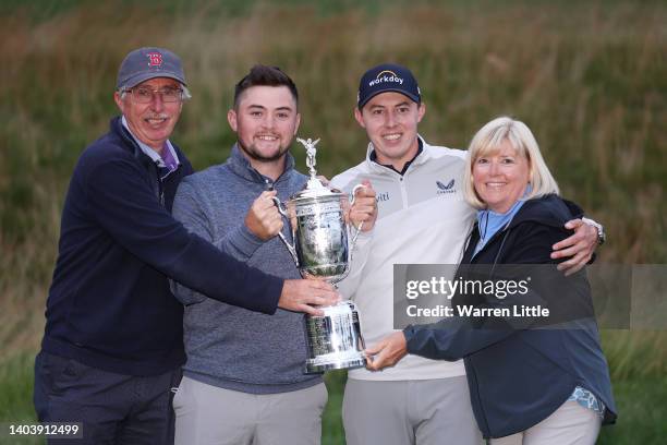 Matt Fitzpatrick of England poses with the U.S. Open Championship trophy alongside father Russell , brother Alex and mother Susan after winning...