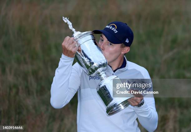 Matthew Fitzpatrick of England holds the trophy after his one shot victory in the final round of the 2022 U.S.Open at The Country Club on June 19,...