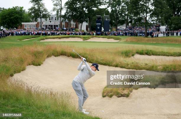 Matthew Fitzpatrick of England plays his second shot on the 18th hole during the final round of the 2022 U.S.Open at The Country Club on June 19,...
