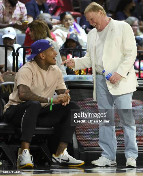 Tight end Darren Waller of the Las Vegas Raiders talks with Raiders owner and managing general partner and Las Vegas Aces owner Mark Davis during the...