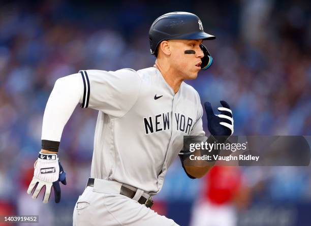 Aaron Judge of the New York Yankees runs to first base during a MLB game against the Toronto Blue Jays at Rogers Centre on June 18, 2022 in Toronto,...