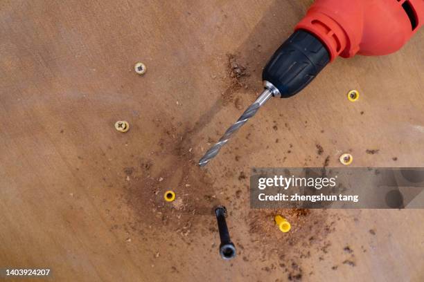 drill tool and screw on wood table furniture.assembly - daily life in dalian stock pictures, royalty-free photos & images