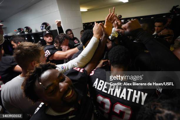 Houston Gamblers players celebrate in the locker room after the Houston Gamblers defeated the New Orleans Breakers 20-3 at Legion Field on June 19,...