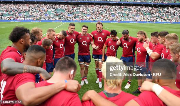 Tom Curry speaks to his teammates after the International match between England and Barbarians at Twickenham Stadium on June 19, 2022 in London,...