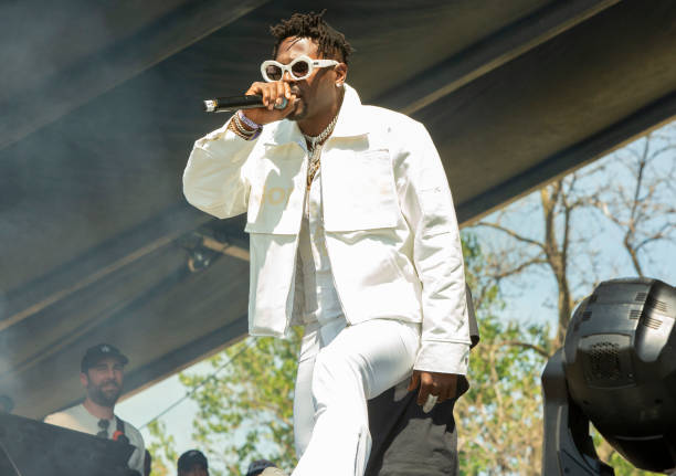 Professional football player Antonio Brown performs with GloUpJake at the Summer Smash Festival at Douglass Park on June 19, 2022 in Chicago,...