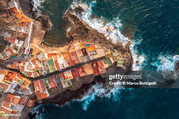 aerial view of colorful village on the coast - isla de gran canaria fotografías e imágenes de stock