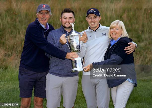 Matthew Fitzpatrick of England holds the trophy with his brother Alex Fitzpatrick, his father Russell Fitzpatrick and his mother Susan Fitzpatrick...