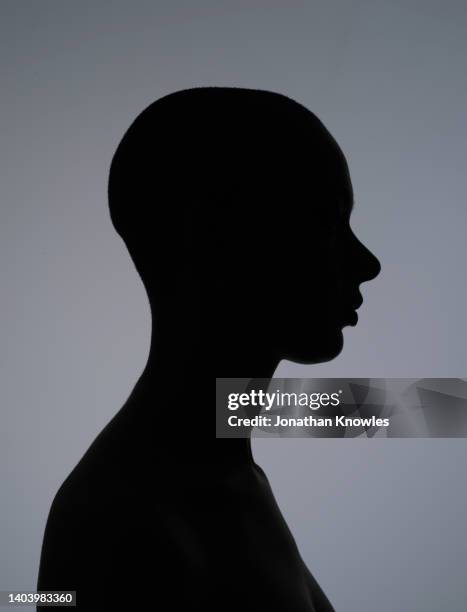 silhouette young woman with shaved-head - shaved head ストックフォトと画像