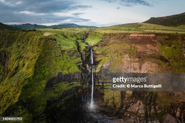 scenic waterfall in flores island, azores - flores stock-fotos und bilder