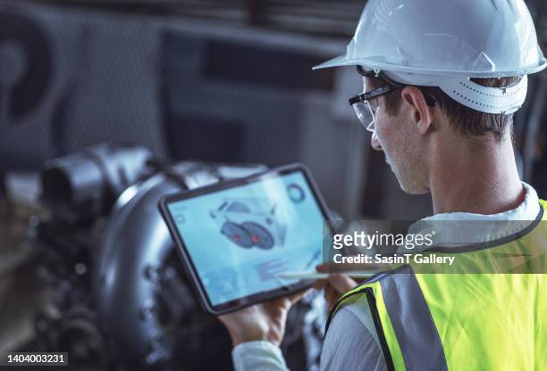 industrial engineer works on the personal computer designing tool part in 3d. - tablet screen stockfoto's en -beelden