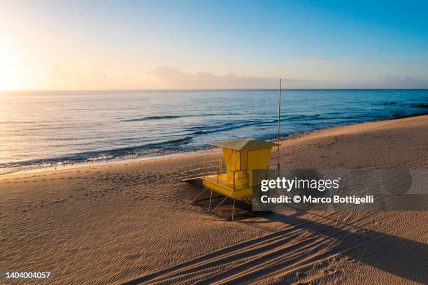 yellow lifeguard post on the beach - beach rescue aerial stockfoto's en -beelden