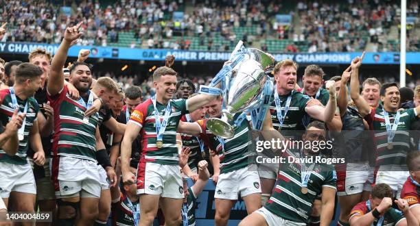 Ellis Genge and George Ford of Leicester Tigers raise the Premiership trophy after their victory during the Gallagher Premiership Rugby Final match...