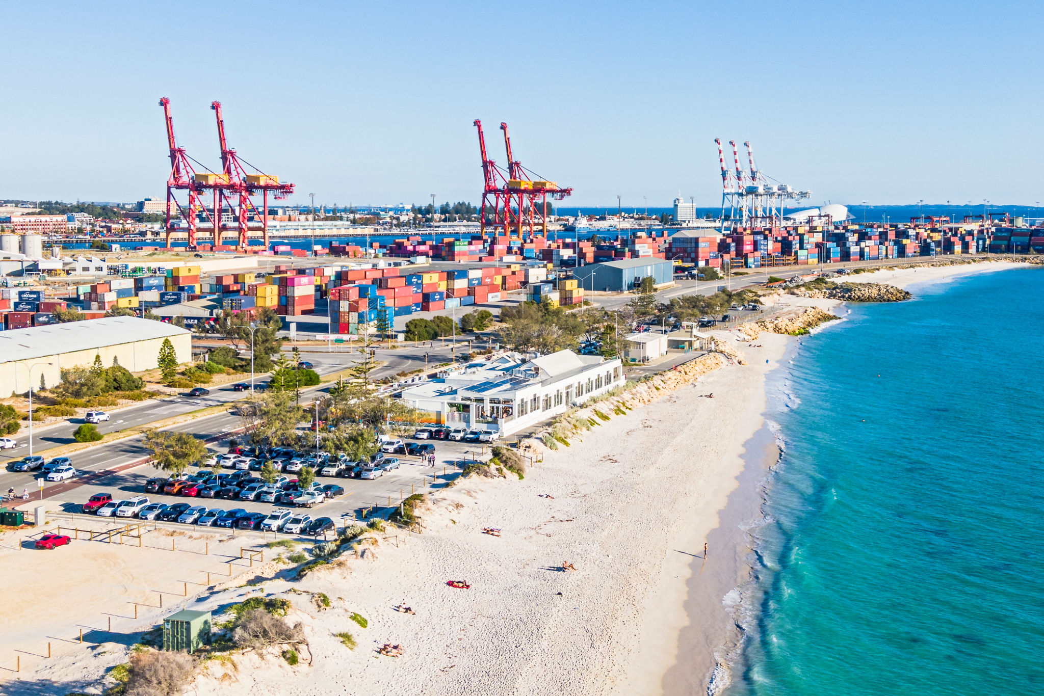Aerial sunny view of Fremantle's Port Beach with nearby busy container port Aerial sunny view of Fremantle's Port Beach with nearby busy container port