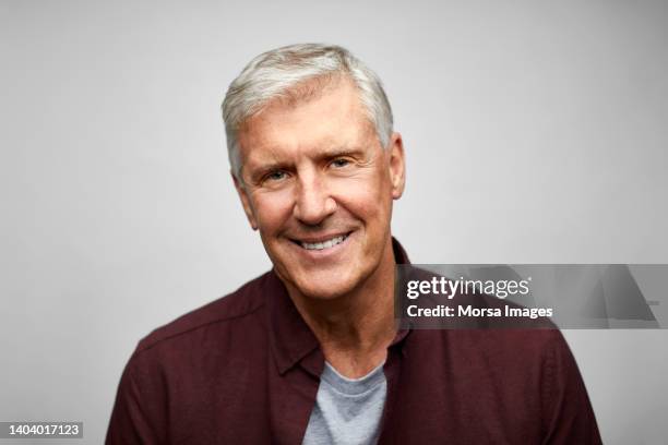 senior businessman smiling on white background - male man portrait one person business confident background stock pictures, royalty-free photos & images