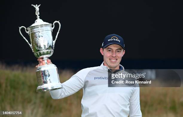 Matthew Fitzpatrick of England celebrates with the winners trophy after the final round of the 122nd U.S. Open Championship at The Country Club on...
