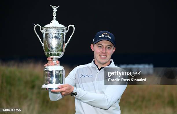 Matthew Fitzpatrick of England celebrates with the winners trophy after the final round of the 122nd U.S. Open Championship at The Country Club on...