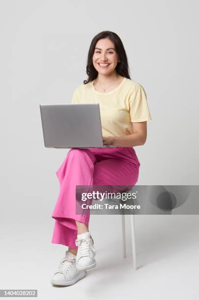 woman with laptop - laptop white background stock-fotos und bilder