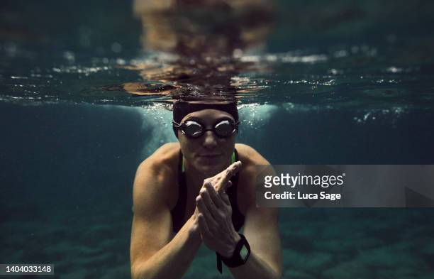 woman wild swimming in ibiza - bright future stock pictures, royalty-free photos & images