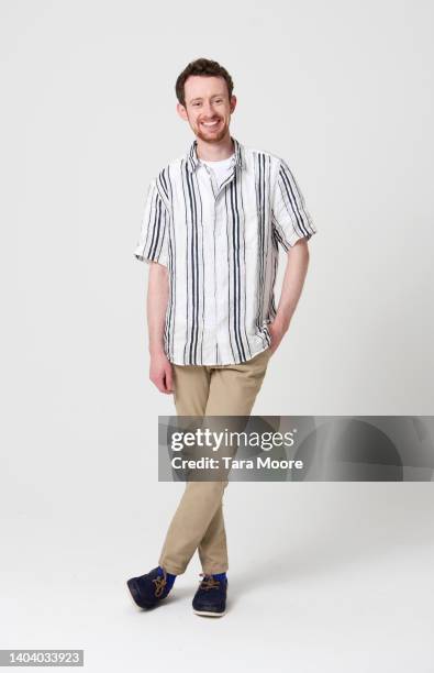 man smiling at camera - man walking toward camera on white stock pictures, royalty-free photos & images