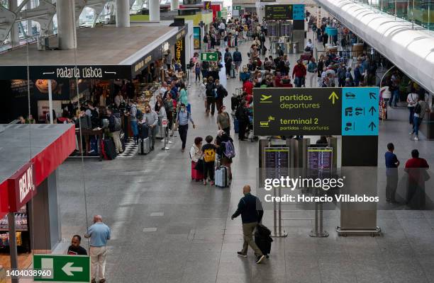 People at the arrivals hall of Terminal 1 in Humberto Delgado International Airport on June 20, 2022 in Lisbon, Portugal. The city's airport has...