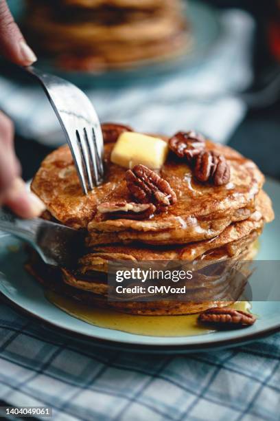 pancakes with butter, pecans and maple syrup - nut butter stock pictures, royalty-free photos & images