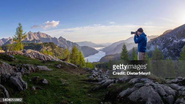 mountain photographer at  sunrise with view to watzmann in nationalpark berchtesgaden, alps - landscape photographer stock pictures, royalty-free photos & images