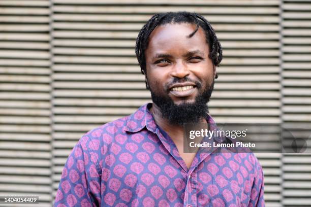 head shoot of a smiling black man who looks at the camera - blind stock pictures, royalty-free photos & images