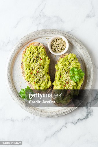 Toast with mashed avocado and hemp seeds Toast with mashed avocado and hemp seeds