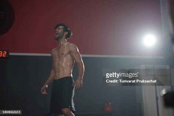 male athlete stressed from gym training. - entrenamiento de fuerza fotografías e imágenes de stock