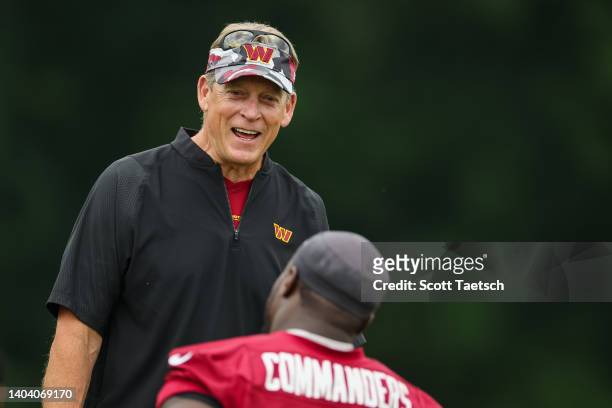 Defensive coordinator Jack Del Rio of the Washington Commanders interacts with players during the organized team activity at INOVA Sports Performance...