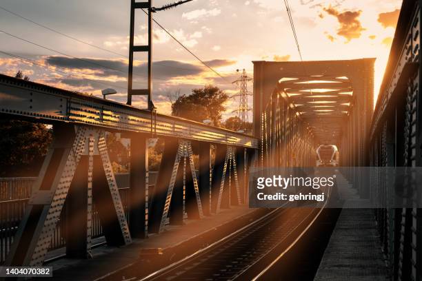 high speed train in motion at sunset, europe, hungary - rail transportation freight stock pictures, royalty-free photos & images