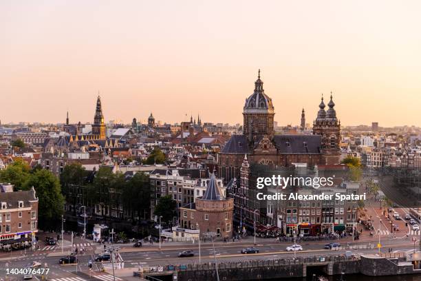 amsterdam cityscape at sunset, aerial view, netherlands - amsterdam foto e immagini stock