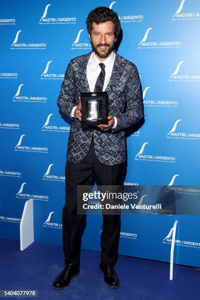 Francesco Scianna poses with his Best Comedy Actor Award for "Il Filo Invisibile" at the 76th Nastri D'Argento 2022 on June 20, 2022 in Rome, Italy.