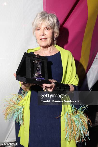 Caterina Caselli poses with her "Protagonista Dell’Anno" Award for "Caterina Caselli - Una vita, cento vite" at the 76th Nastri D'Argento 2022 on...