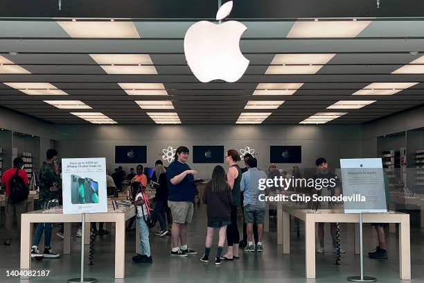 Customers shop at The Apple Store at the Towson Town Center mall, the first of the company's retail locations in the U.S. Where workers voted over...